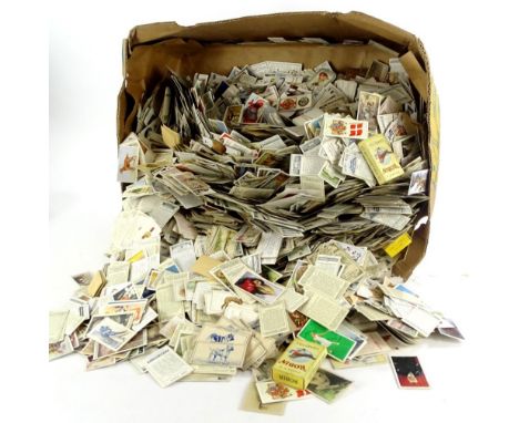 A large quantity of unsorted cigarette and trade cards, etc.