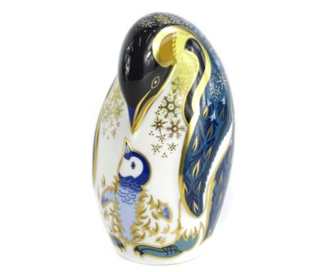 A Royal Crown Derby porcelain penguin and chick paperweight, gold button, boxed.