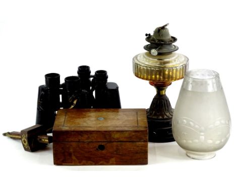 A Victorian oil lamp, with amber tinted cut glass reservoir, two pairs of binoculars, a games box containing draughts, etc.