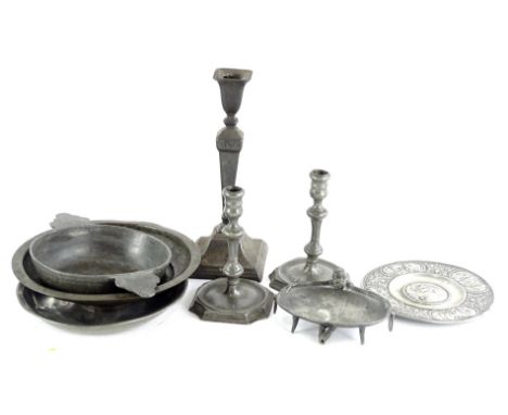 A pair of late 18th/early 19thC continental pewter candlesticks, each with a canted square base and various touch marks, anot