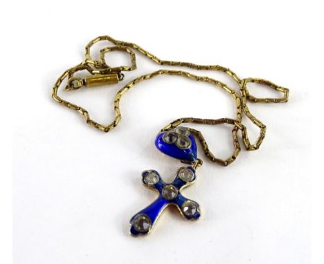 A Victorian enamel crucifix pendant and chain, the crucifix set with five white stones, with heart shaped pendant top, with g
