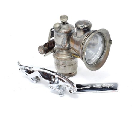 A 1960's Jaguar Chrome Car Mascot, 19cm long; A Jaguar Car Badge; and A Joshua Lucas Nickel-on-Brass 4'' Carbide Lamp (3)