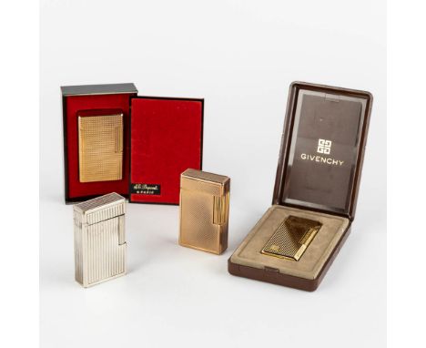 ST. Dupont, Three gold and silver plated lighters, added a Givency lighter.&nbsp;Dimensions: (L:1 x W:3,5 x H:6 cm)