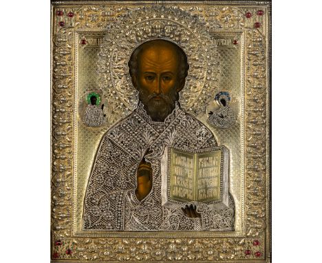 A Russian Icon, 'Nicholas of Myra', gilt silver, vermeil, and tempera on panel. Mark of Yakov Mishukov, Moscow 19th century.&