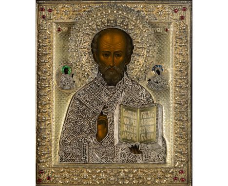 A Russian Icon, 'Nicholas of Myra', gilt silver, vermeil, and tempera on panel. Mark of Yakov Mishukov, Moscow 19th century.&