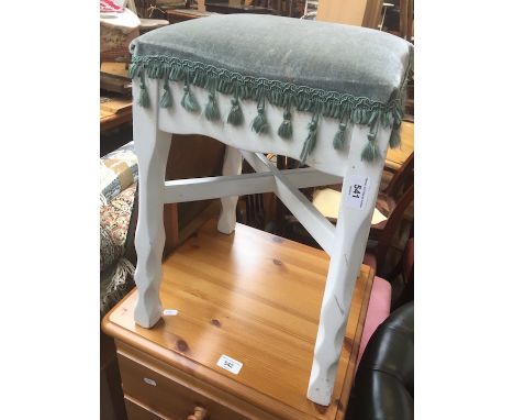 A white painted stool. 