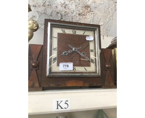 An oak 1930s mantel clock 