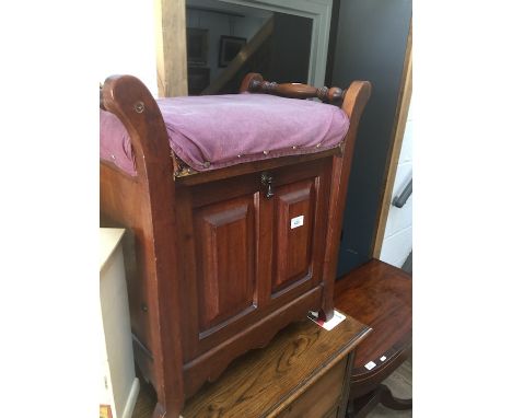 A mahogany piano stool 