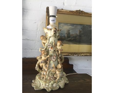 A porcelain figural lamp base. 