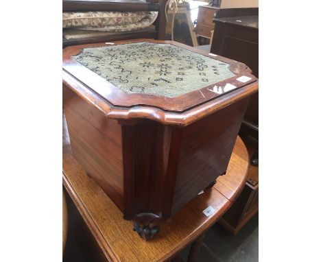A Victorian mahogany commode with needlework top. 