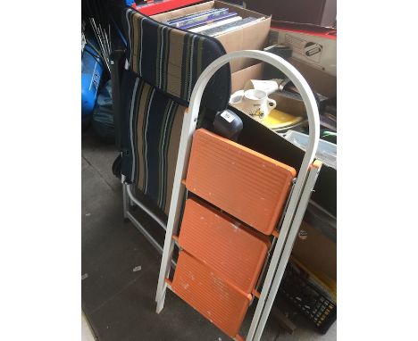 A garden chair and a set of step ladders 