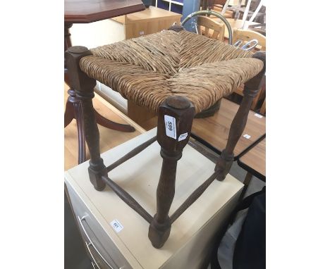 A rush seated stool. 