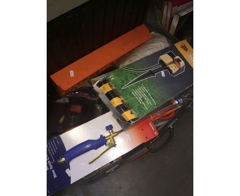 A case of various tools including blow torch, JCB outdoor socket, screwdrivers, hacksaw, etc 