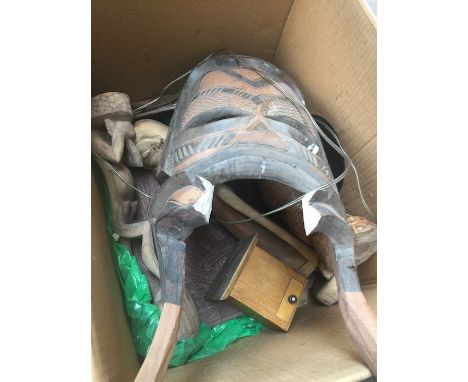 A box of wooden figures to include tribal mask repurposed as lamp, ethnic items, etc 