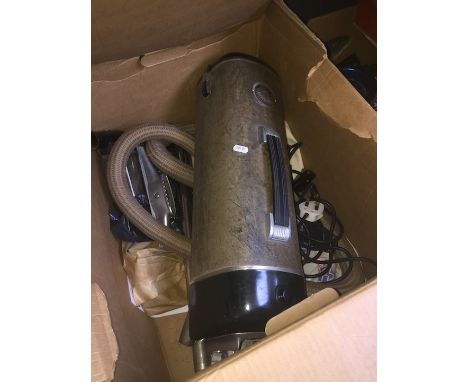 A vintage Electrolux cylinder vacuum cleaner with tools 