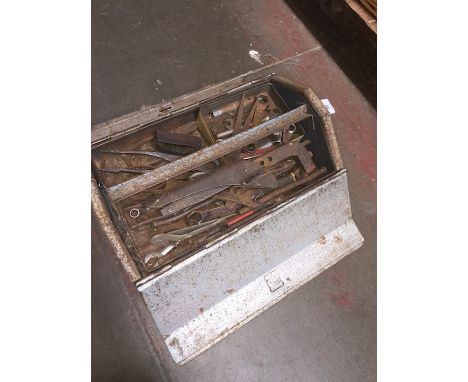 A metal toolbox with tools 