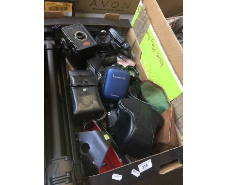 A box of misc cameras and accessories to include Praktica BC1, Olympus, Yashica Electro 35, Lumix digital camera, tripod, Ens