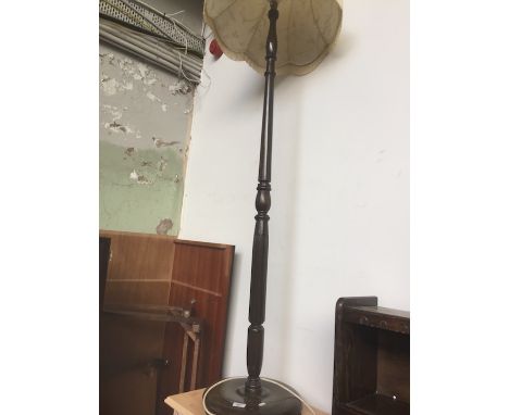 A standard lamp with shade. 