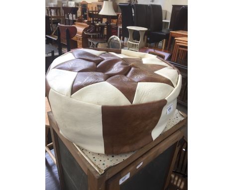 A retro cream and brown leather foot stool. 