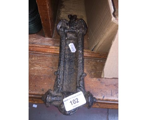 A cast iron letterbox/ door knocker 