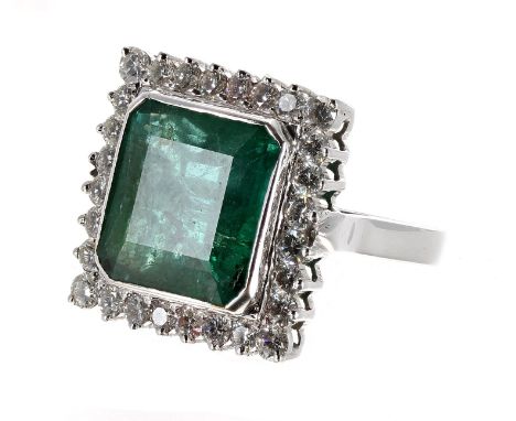 Impressive and large 14k white gold emerald and diamond square set cluster ring, the emerald 10.20ct, within a surround of ro