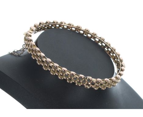 9ct gate link style bangle with safety chain, 15.4gm, width 67mm 