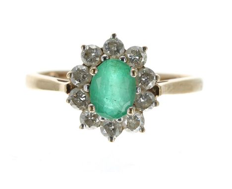 Large 9ct emerald and diamond oval cluster ring, the emerald 1.00ct approx, in a surround of ten round brilliant-cut diamonds