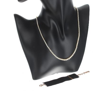 Antique graduated pearl necklace with a diamond set clasp, 2mm to 4.5mm, 6.5gm, 15.5" long; also a 9ct mounted black fabric c