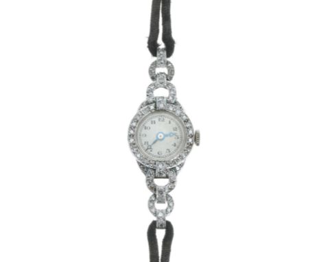 Vertex platinum and diamond lady's cocktail wristwatch, silvered dial with Arabic numerals and moon hands, signed 15 jewel mo