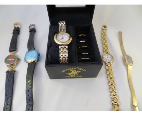 A boxed, ladies Beverly Hills Polo Club quartz watch, with 6 interchangeable bezels, and four other ladies quartz watches inc