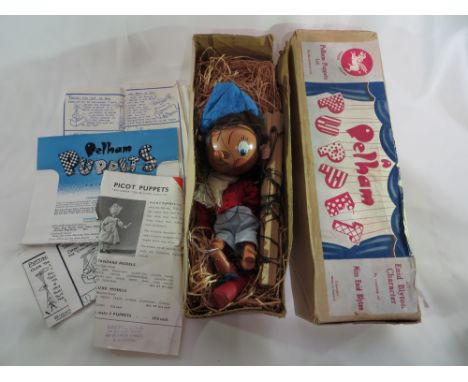 A Noddy Pelham puppet in box with instructions.