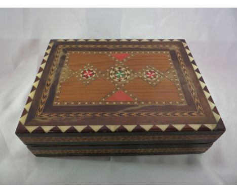 A Tunbridge folding chess set with varnished wooden pieces. 