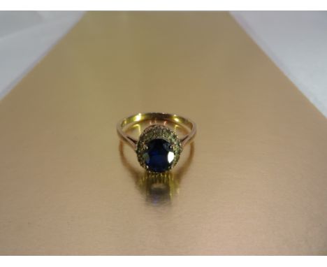 A 9ct gold ring with Sapphire and diamonds. London, 1968. Size: Q/R, gross weight: 2.7g