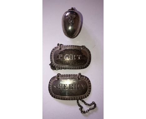 A pair of silver decanter labels, Rebecca Emes and Edward Barnard I, London 1824 and thimble holder with thimble, unmarked. 