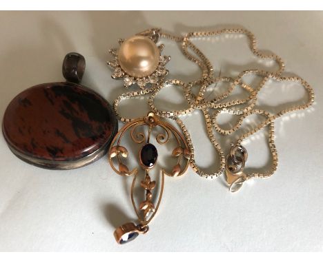 Three pendants including 9ct gold.