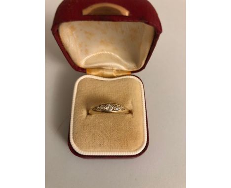An 18ct carat gold ring set with 5 diamonds, size L/M, 3.9gms.
