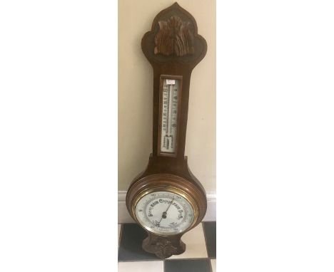 Oak aneroid barometer, 73cms h. 