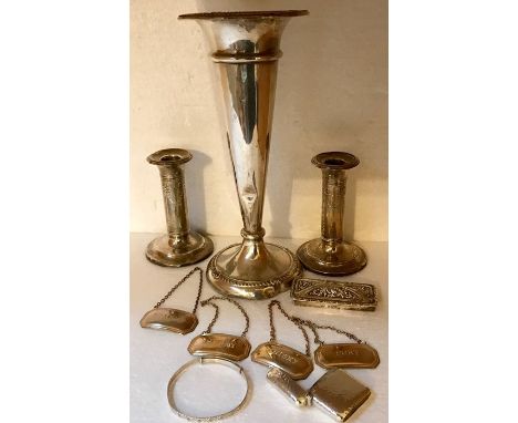 Ten various items of silver to include candlesticks, vesta, decanter labels etc.