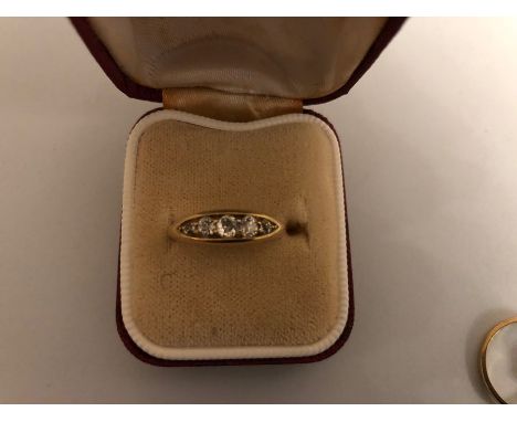 An 18 carat  gold ring set with 5 diamonds, size J