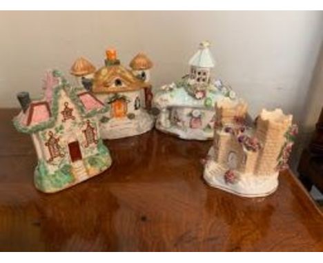 Four various ceramic cottages