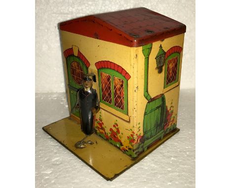 A collection of biscuit tins/money boxes, A 1920's Original Gray Dunn biscuit tin mechanical money bank house, overall very g