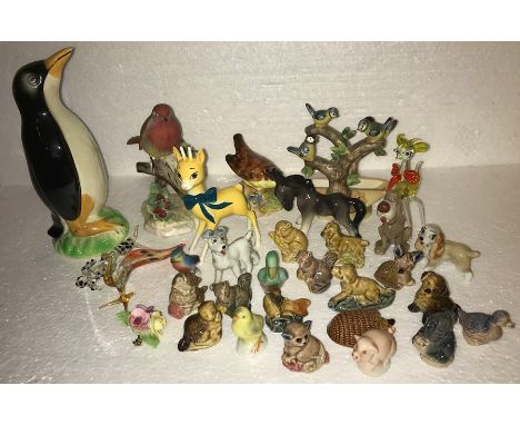 A selection of Decorative animal ceramics and glass comprising wade, Wymsies, Beswick, Adderley, Denton China, Goebel with cr