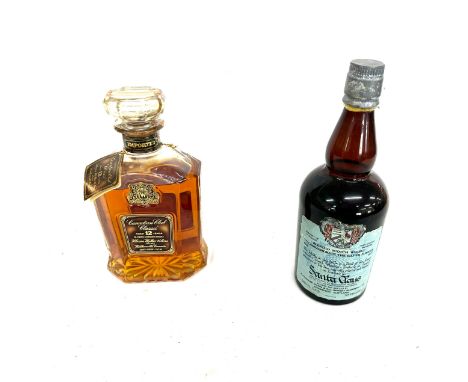 Bottle of Aged 12 years canadian club whisky 1973 and a bottle of santa claus scotch whisky