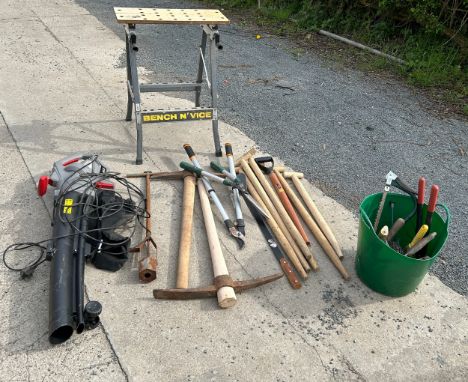 Eckman leaf blower in working order with a selection of large gardening tools and a bench vice 