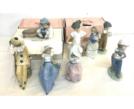 Selection of boxed Nao figures includes boy with dog, ladu with bird etc 