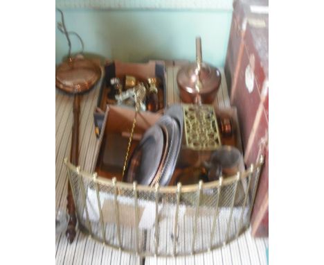A quantity of copper, brass and other metalware, to include: a kettle, trivet, fireguard, candlesticks and other items. Condi