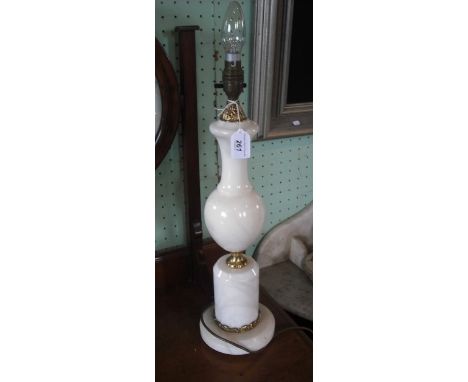 An onyx and brass columnar table lamp on circular foot, 50cm.