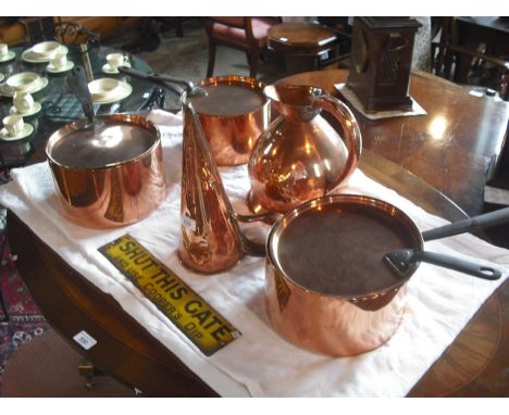 A set of three copper pans and covers, together with an Arts & Crafts style copper jug, funnel and an early 20th century tin 