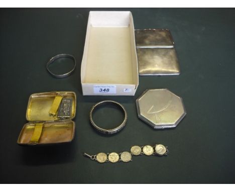 Two silver cigarette boxes, a silver cased compact, silver pendant and other items.