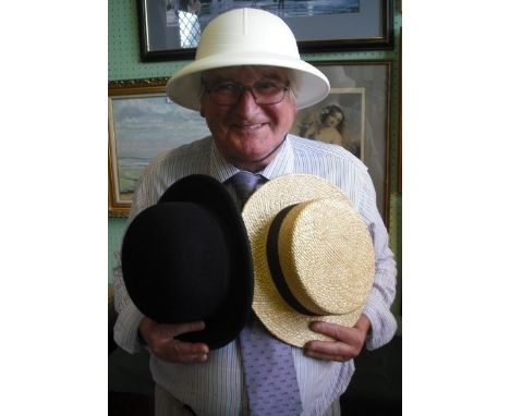 A US postal service sun helmet, together with 'Luton Civic Boater' and a Tylers bowler hat.
